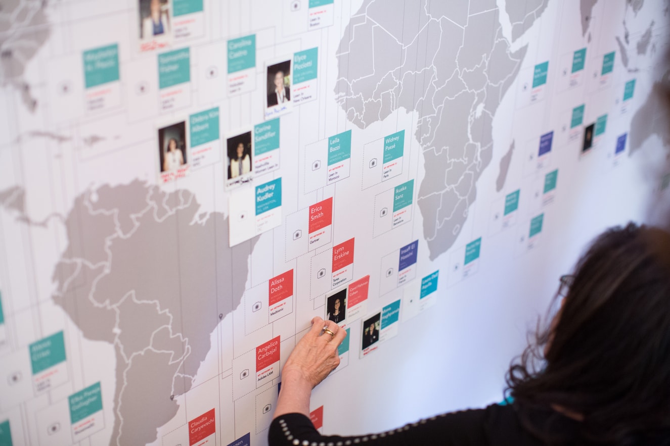 Lean In Circle leaders locate their names on a map at an annual conference. There are over 40,000 Lean In Circles in 170 countries, one of the world’s largest communities of women who meet regularly.